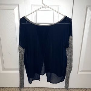 See through top with cloth sleeves.